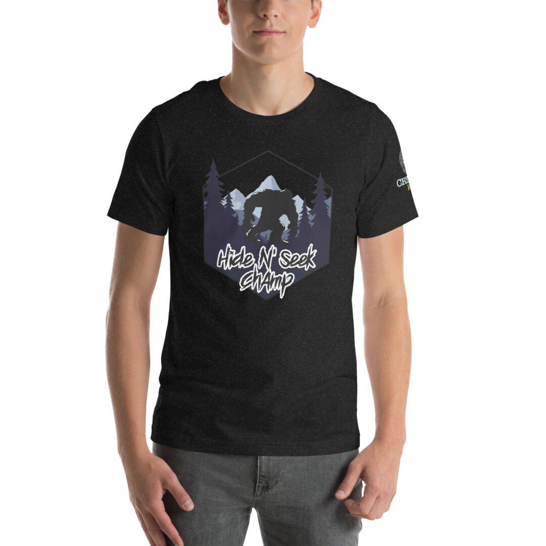 Hide N Seek Champ - Sasquatch / Bigfoot - Forest and Mountains Scene - Unisex Soft T-Shirt - Heather Black - Cryptid & Kin